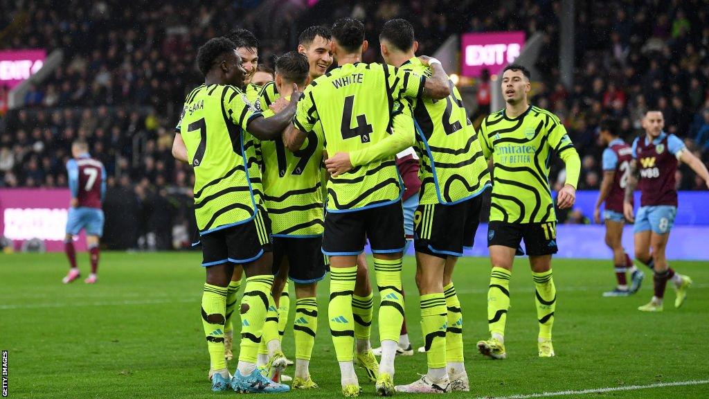 Arsenal players celebrate scoring against Burnley