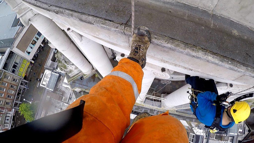 Workers abseiling