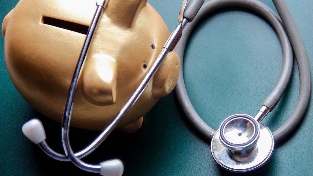 Piggy bank with stethoscope