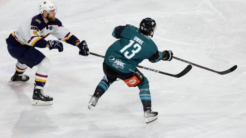 Belfast's Steven Owre battles with Guildford's Eamon McAdam at the SSE Arena