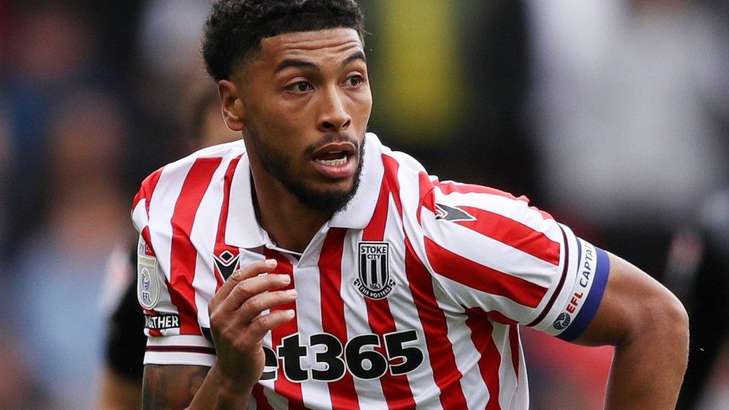 Josh Laurent on the pitch running for Stoke during a game