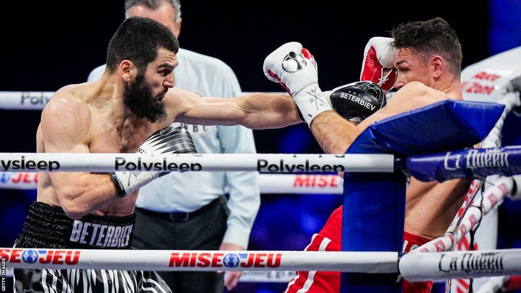 Callum Smith is backed up onto the ropes by Artur Beterbiev in Quebec, Canada