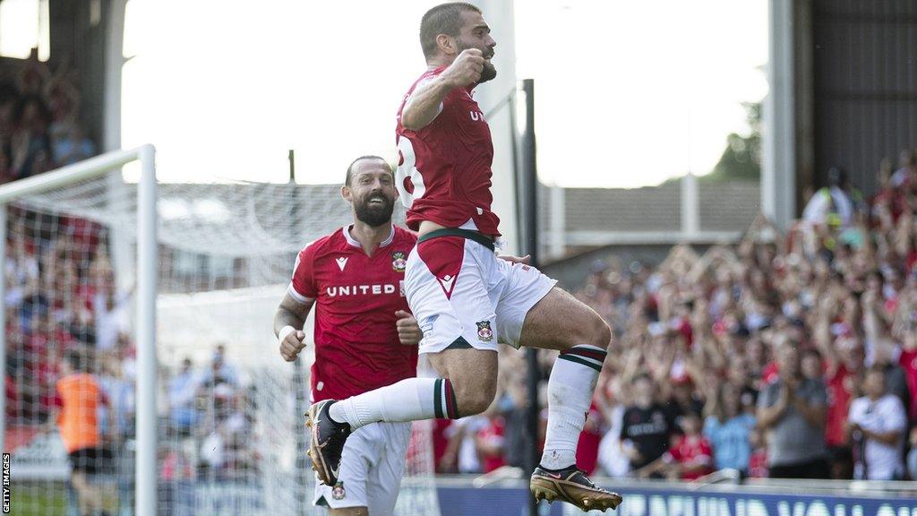 Elliot Lee celebrates after scoring for Wrexham against Grimsby Town