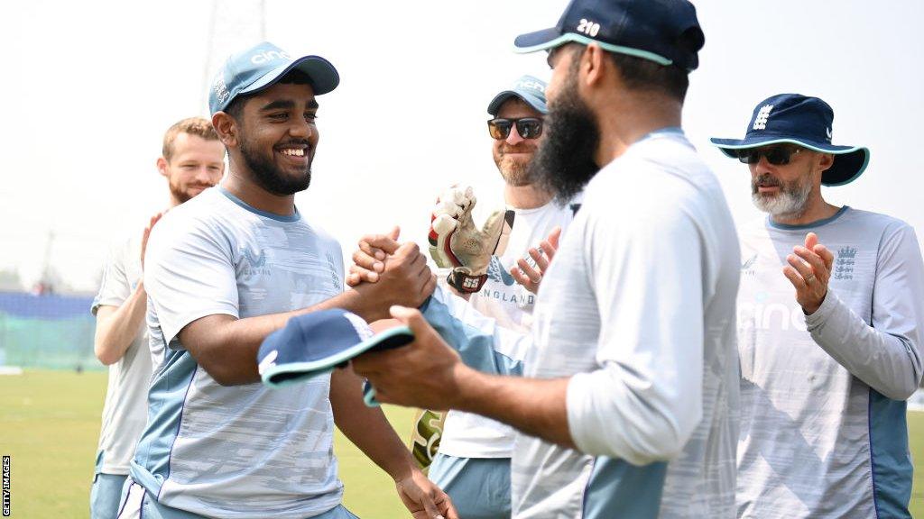 Adil Rashid presents Rehan Ahmed his cap