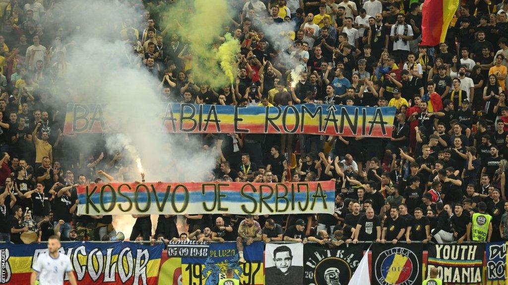 Romania fans with anti-Kosovan and nationalistic banners during the match in Bucharest