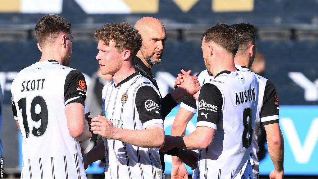 Notts County boss Luke Williams with his players