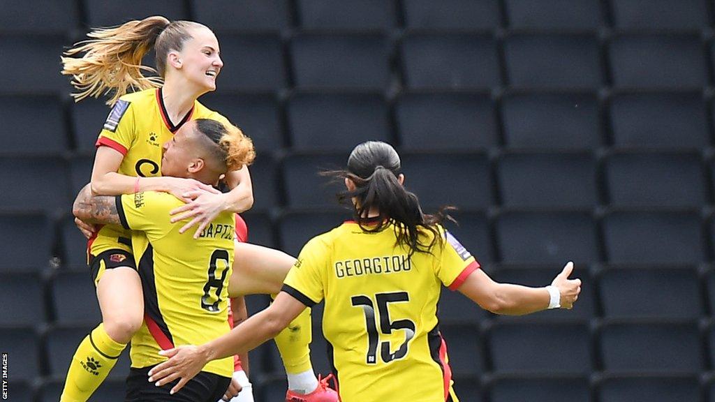 Poppy Wilson is lifted off the ground and hugged after scoring for Watford against Nottingham Forest in the Women's National League play-off final