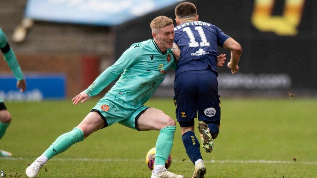 Daniel Armstrong is pulled back by Craig Sibbald