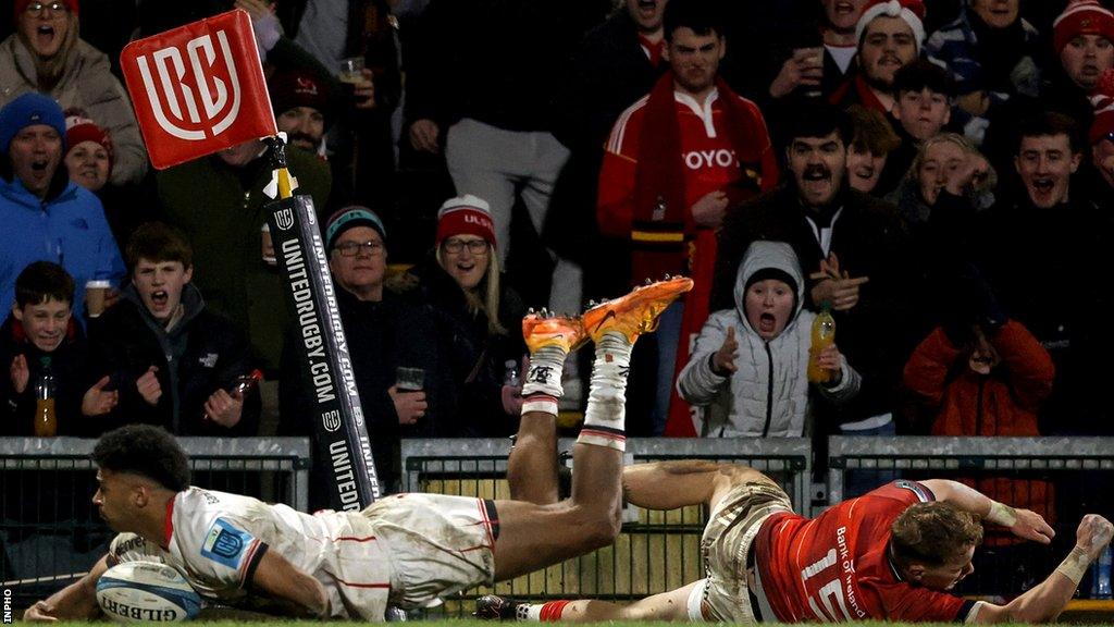 Robert Baloucoune scores Ulster's second-half try despite the efforts of Munster full-back Mike Haley