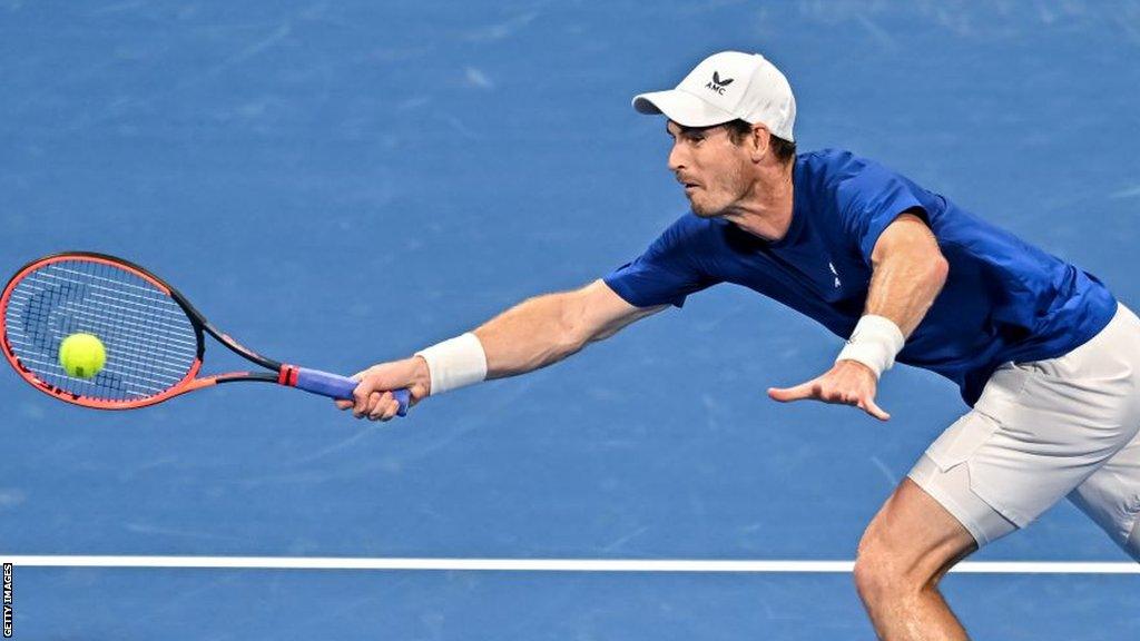 Andy Murray stretches for a return at the Qatar Open