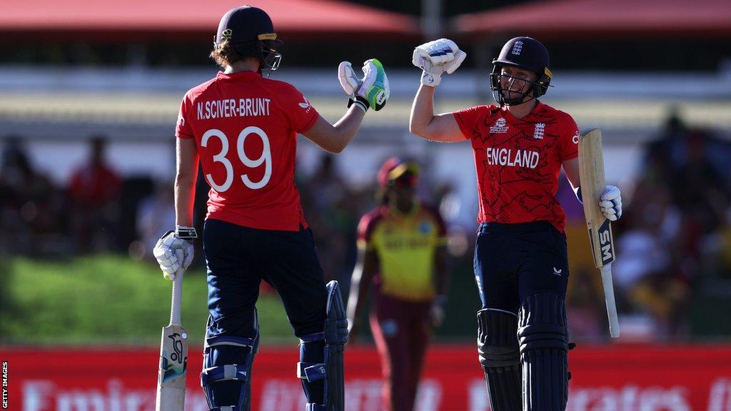 Nat Sciver-Brunt and Heather Knight bump fists while batting together