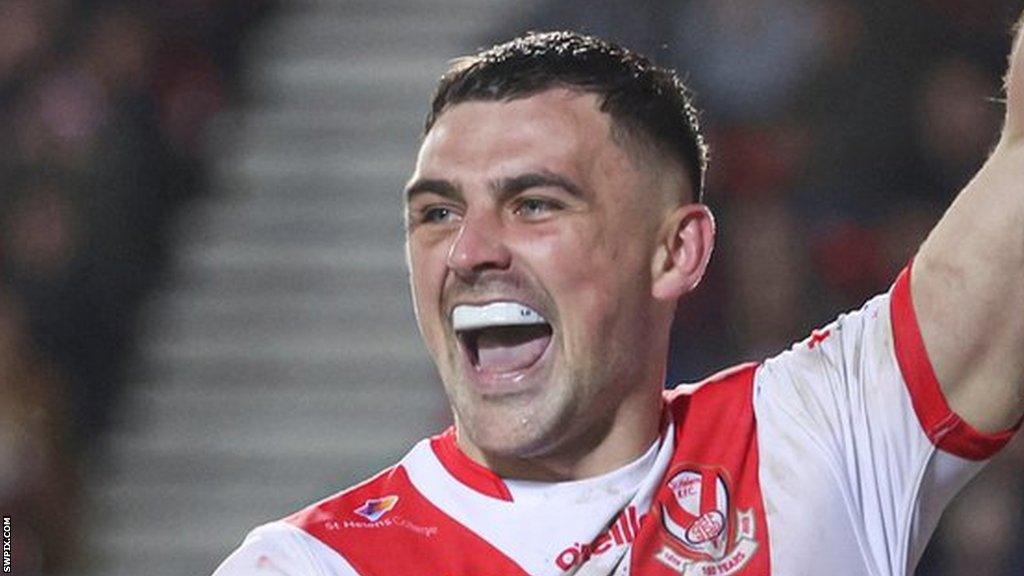 St Helens player Lewis Dodd celebrates scoring a try