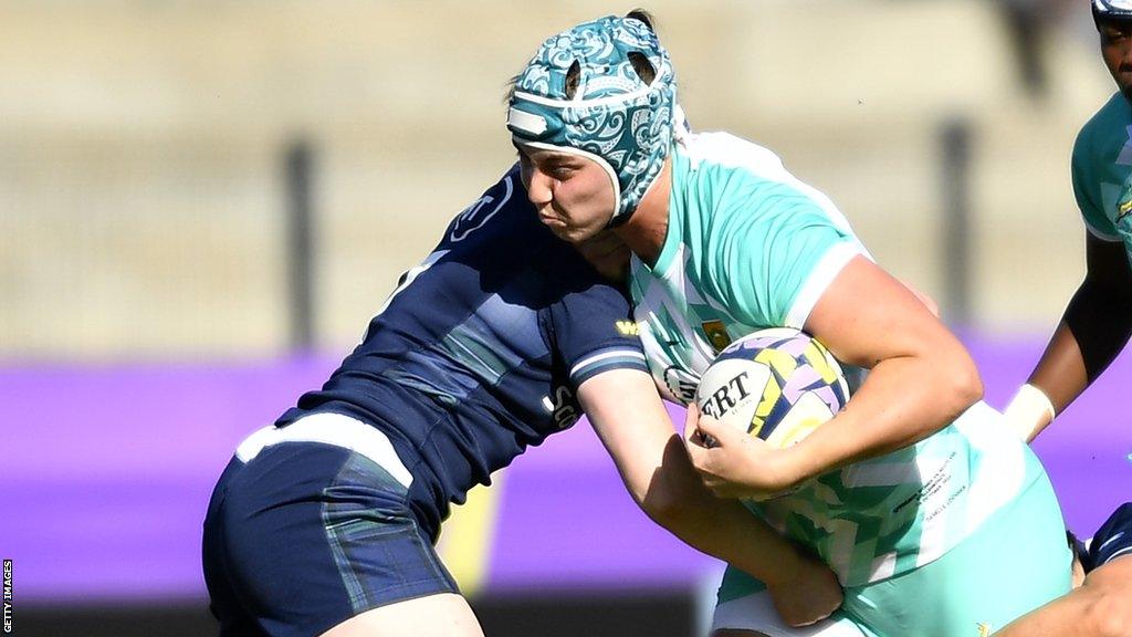 Danelle Lochner (right) is tackled with the ball in hand while playing for South Africa in the WXV tournament