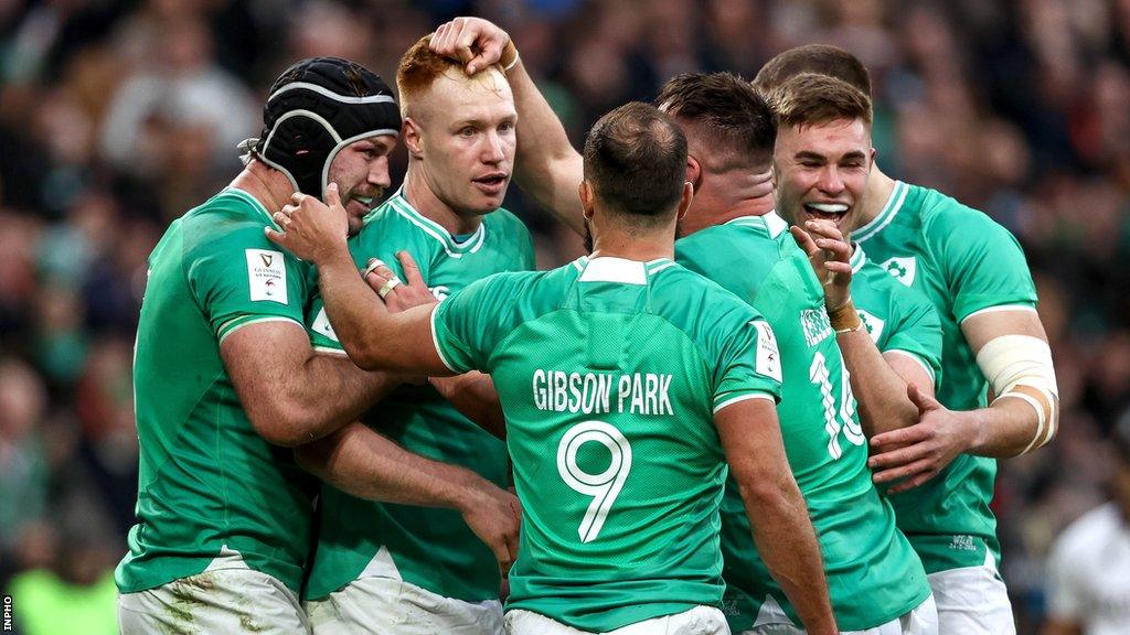 Ciaran Frawley is congratulated after scoring Ireland's third try of the game