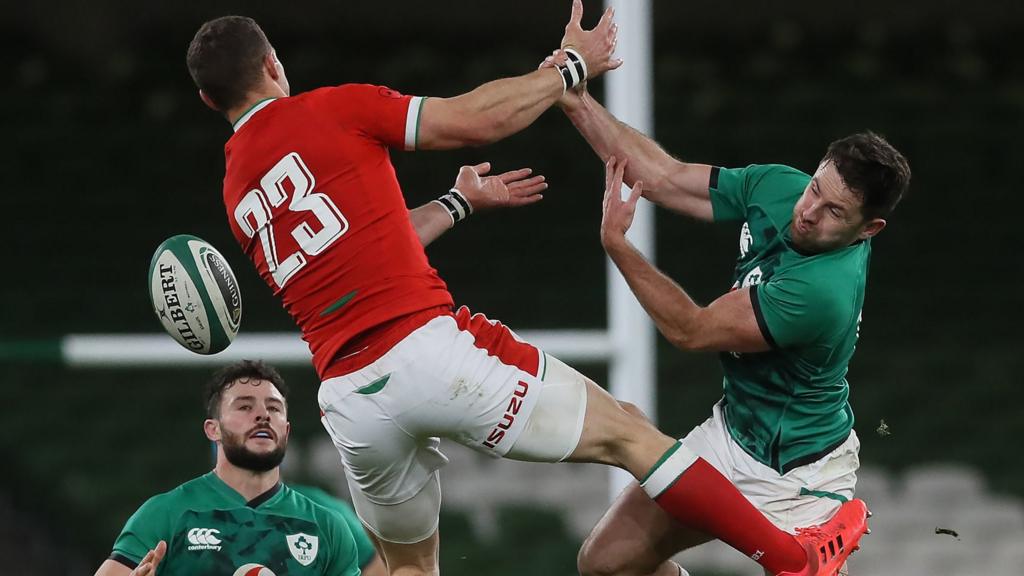 Wales' George North (left) and Ireland's Hugo Keenan in action