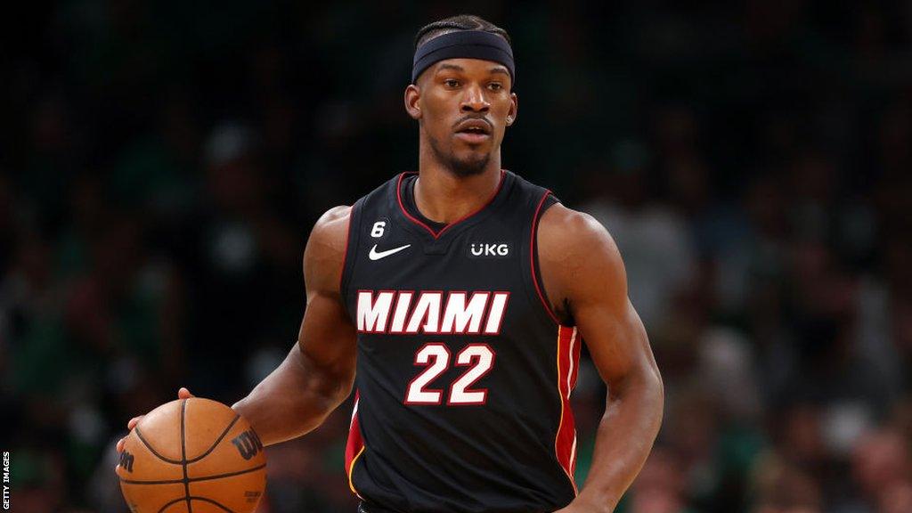 Jimmy Butler dribbles during the Miami Heat's deciding game against the Boston Celtics.