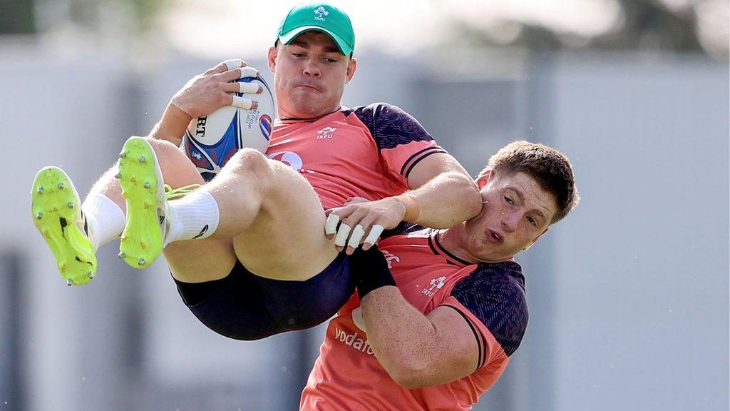 Garry Ringrose gets a lift from Joe McCarthy during Ireland training in France earlier this week