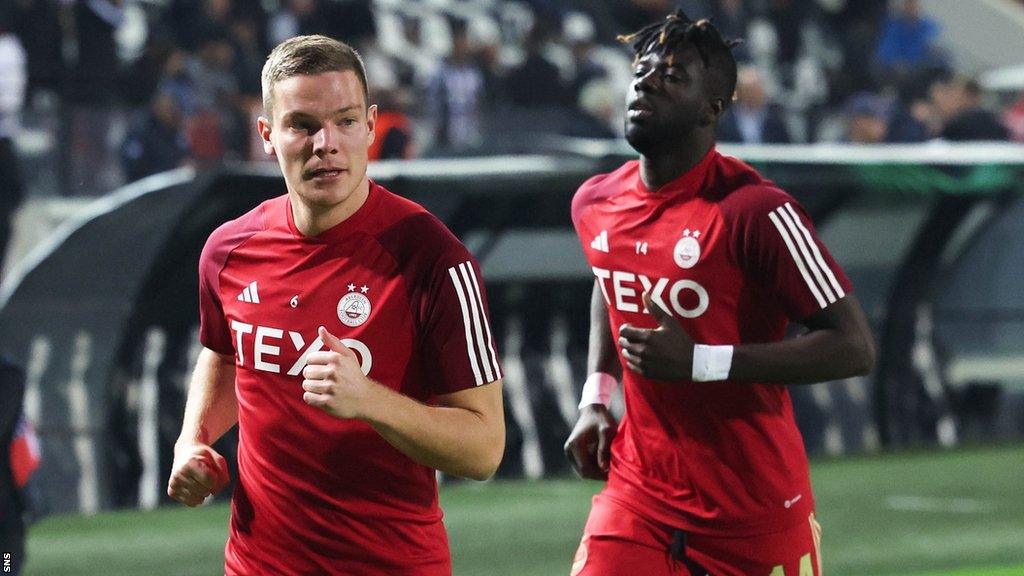 Aberdeen's Stefan Gartenmann and Pape Habib Gueye at the Toumba Stadium