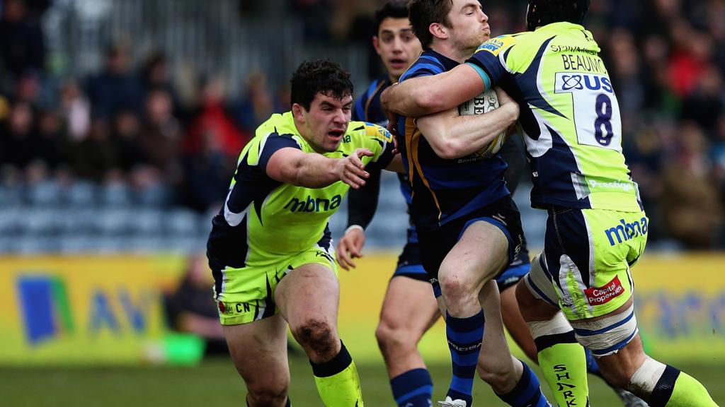 Josh Beaumont of Sale Sharks tackles Tom Heathcote of Worcester Warriors