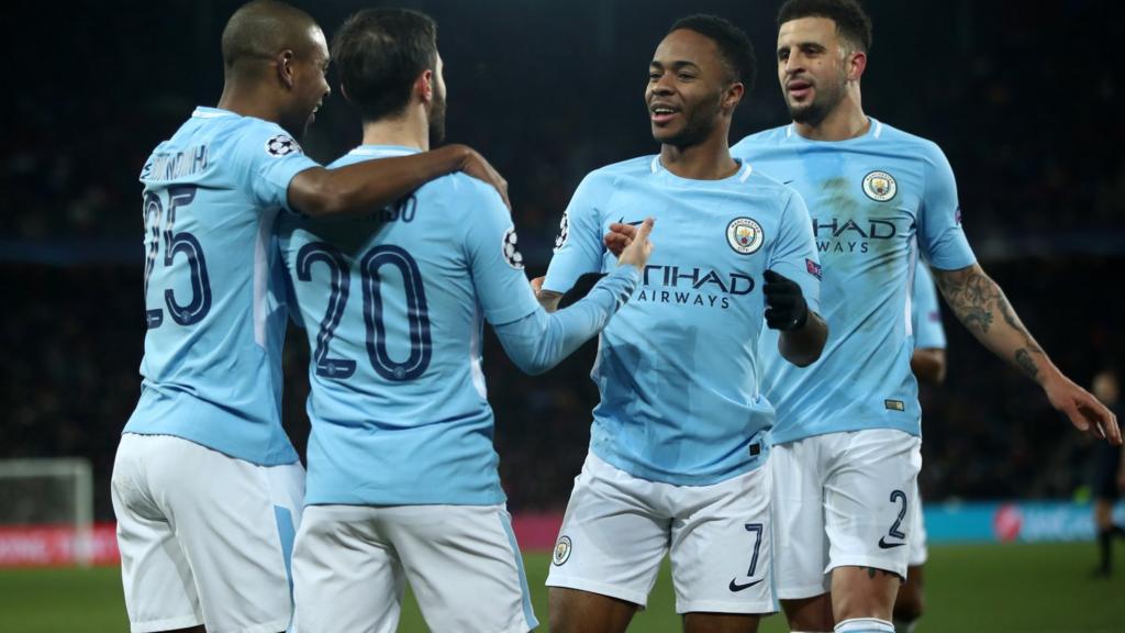 Man City players celebrate their third goal