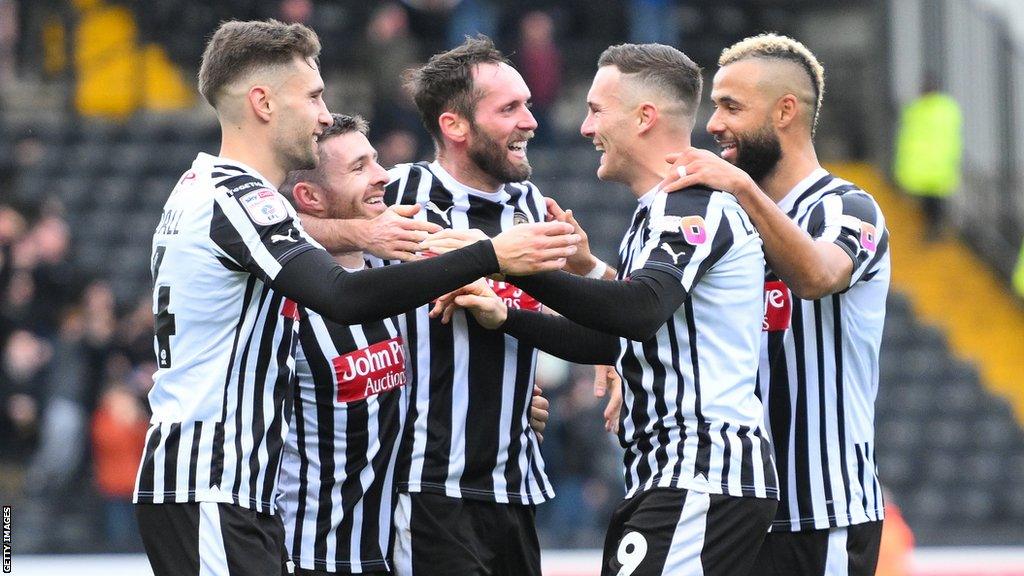 Macaulay Langstaff (second from right) celebrates a goal with Notts County team-mates