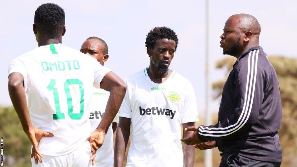 William Muluya with some of the Kariobangi Sharks players