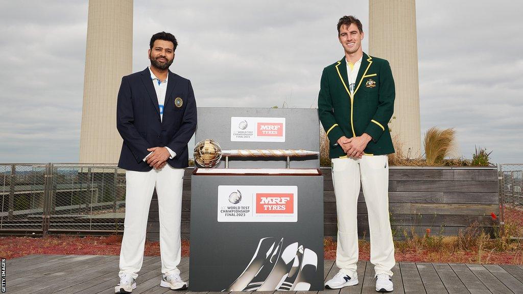 Rohit Sharma, captain of India poses with Pat Cummins, captain of Australia and the ICC World Test Championship mace prior to the ICC World Test Championship Final 2023 at Battersea Power Station on June 05, 2023 in Battersea, England.