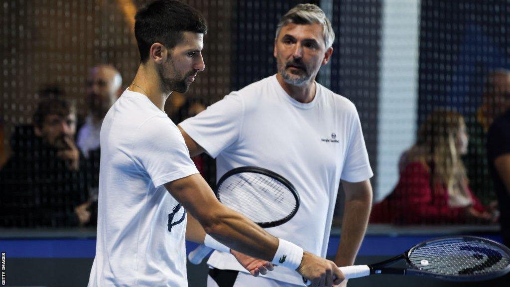 Novak Djokovic of Serbia with coach Goran Ivanisevic during practice