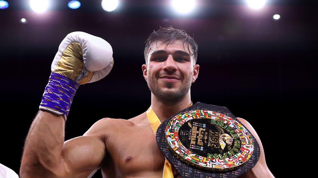 Tommy Fury celebrates after beating Jake Paul