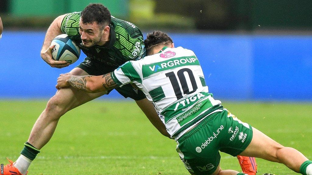 Andrew Smith is tackled by Jacob Umaga