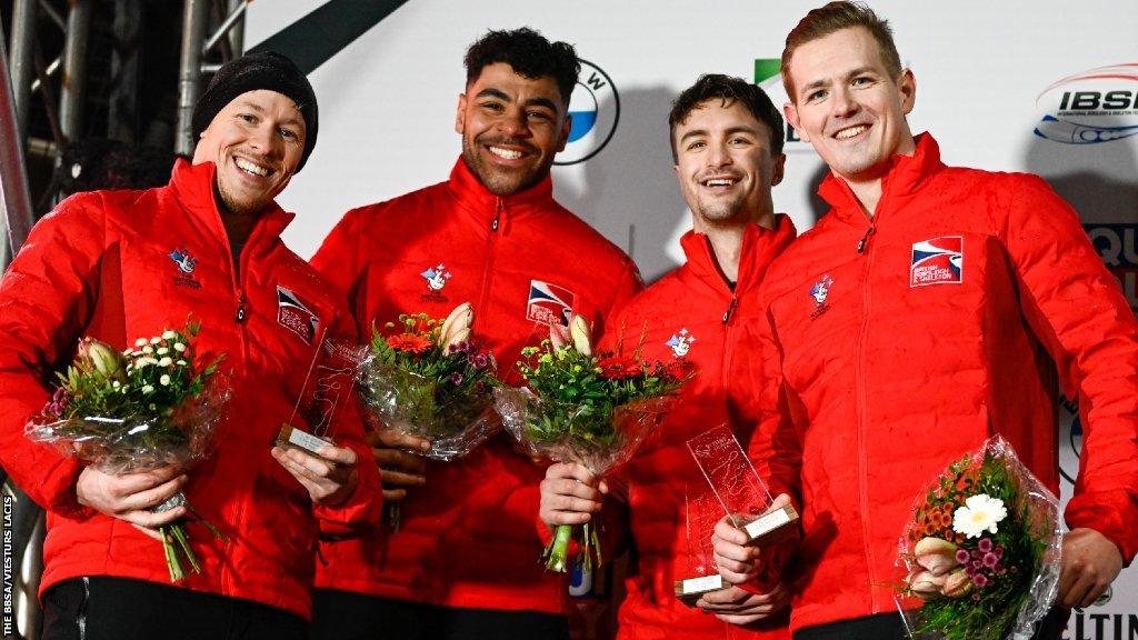 The winners' podium at Winterberg, including GB's four-man team