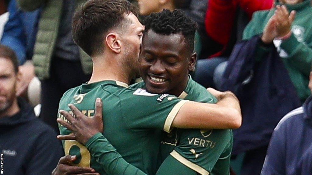 Ryan Hardie and Mustapha Bundu embrace