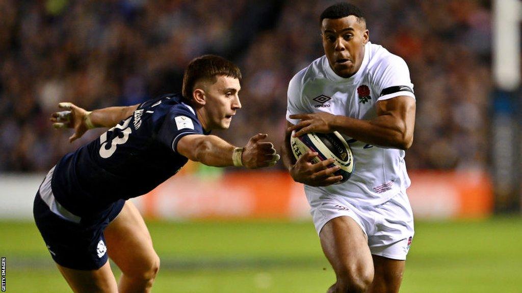 Immanuel Feyi-Waboso evades Cameron Redpath before scoring a try for England against Scotland