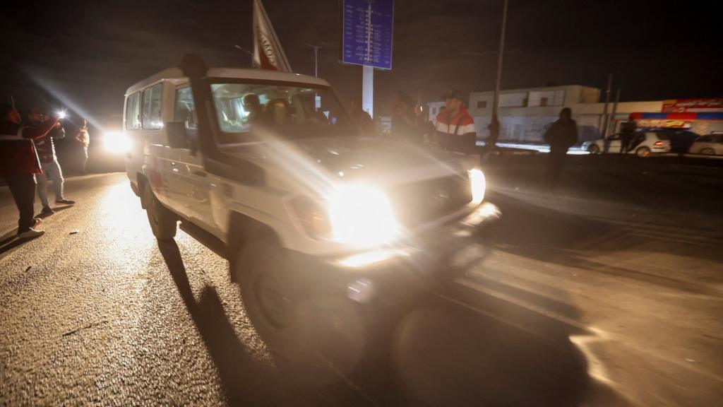 A Red Cross vehicle carrying hostages released from captivity by Hamas