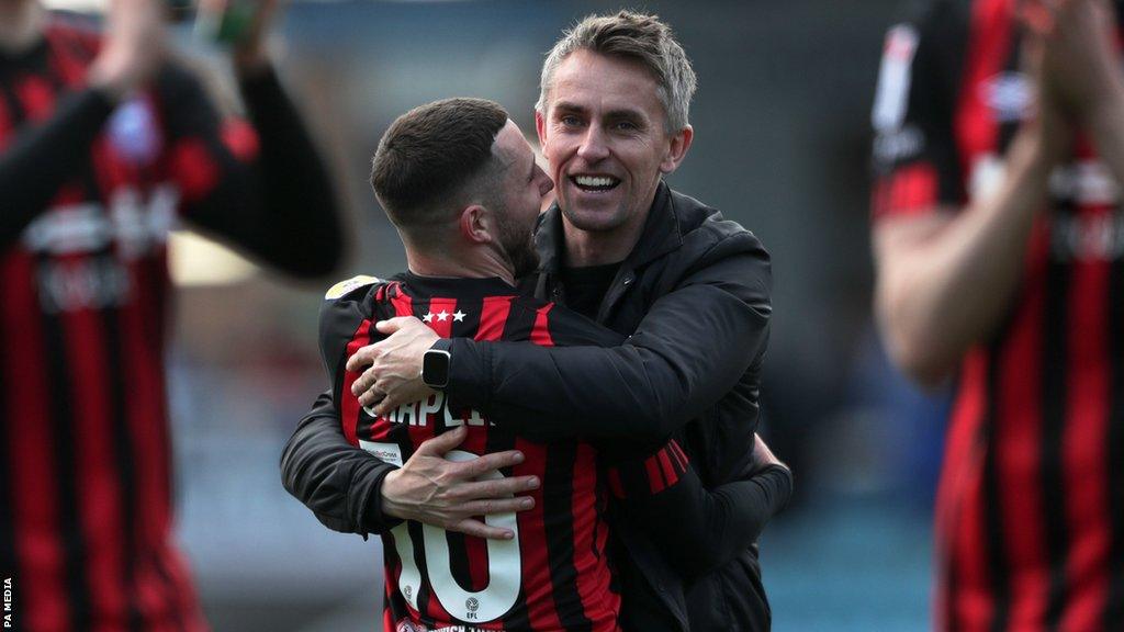 Kieran McKenna embraces striker Conor Chaplin after the win at Shrewsbury