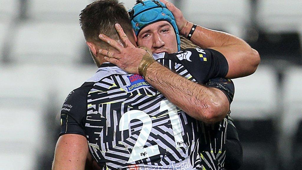 Justin Tipuric gets a hug off Rhys Webb after scoring a try for Ospreys against Northampton