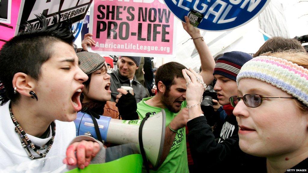 Protesters argue outside the Supreme Court