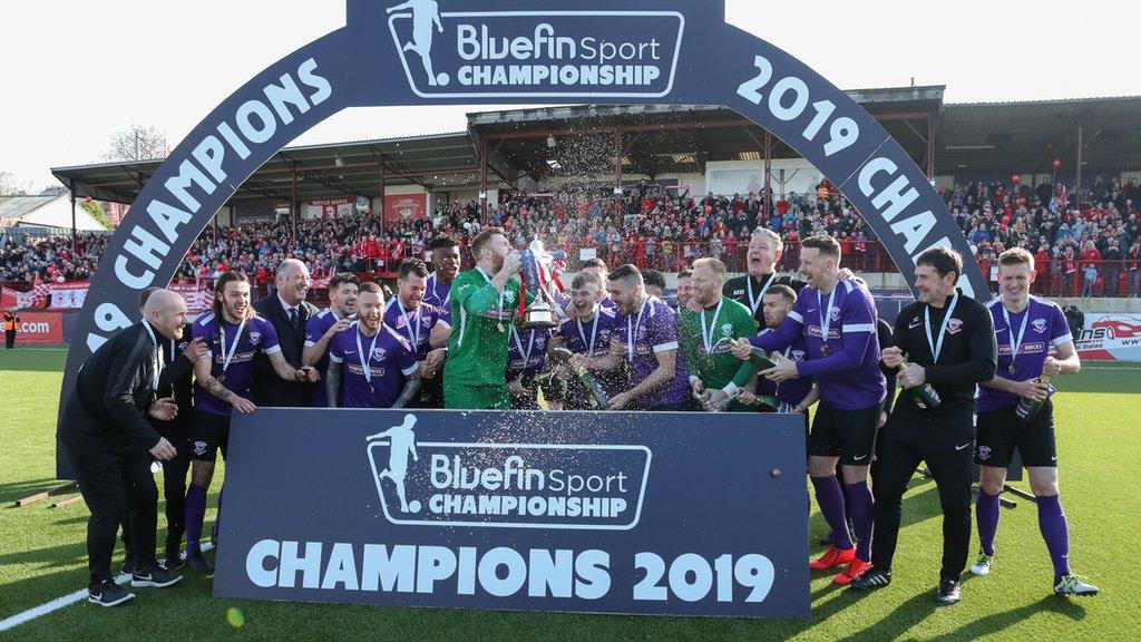 Larne celebrate winning the Championship title