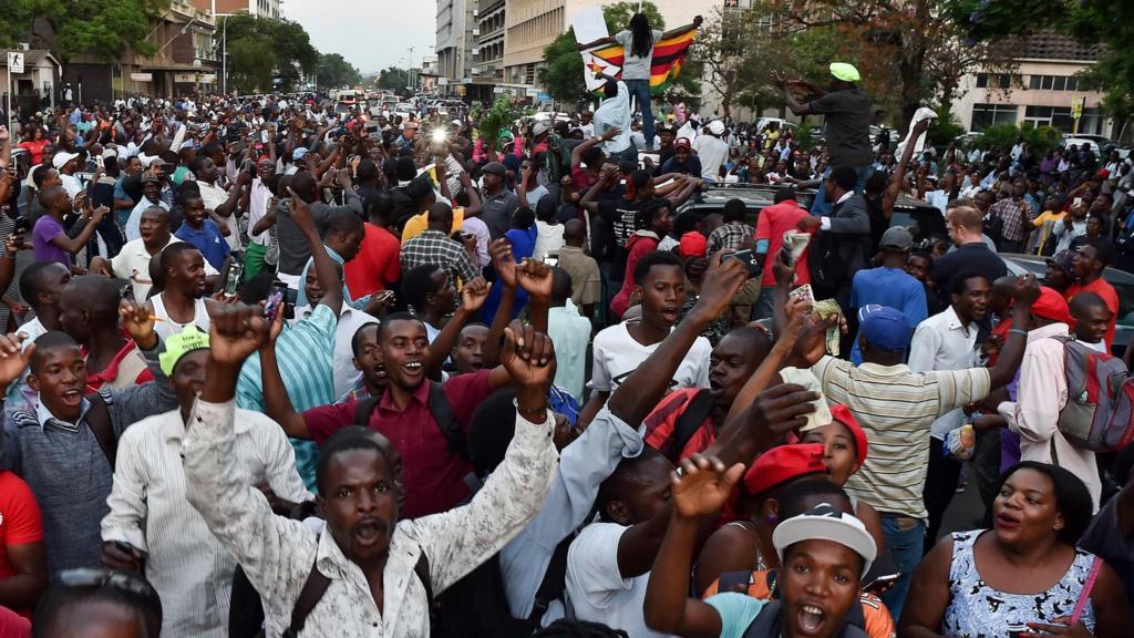 People celebrating in Harare as Mugabe resigns