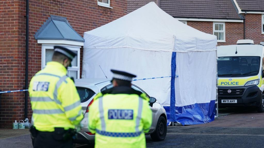 Police and a forensics tent in Allan Bedford Crescent, Queen's Hills