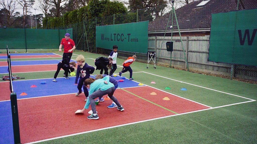 Children doing tennis drills