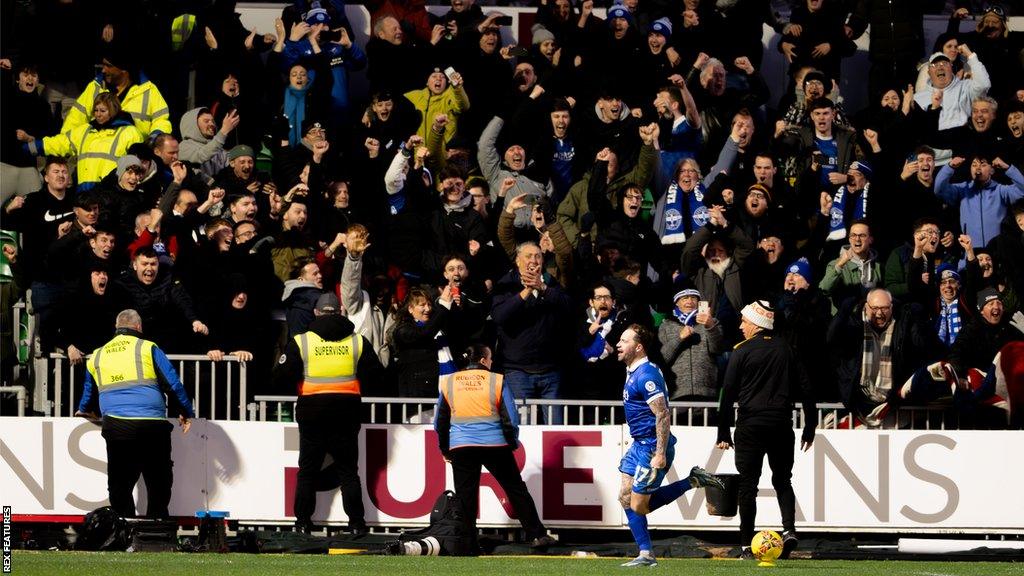 Chris Maguire celebrates