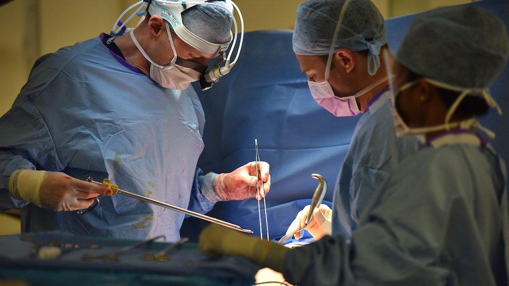 Surgeons performing an operation.