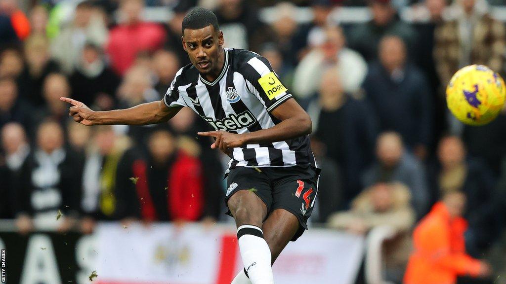 Newcastle striker Alexander Isak strikes the ball