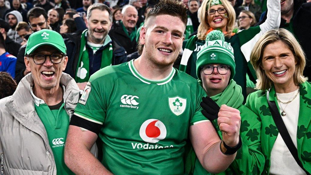 Joe McCarthy with his parents Joe and Paula, and brother Andrew after Ireland's win over France