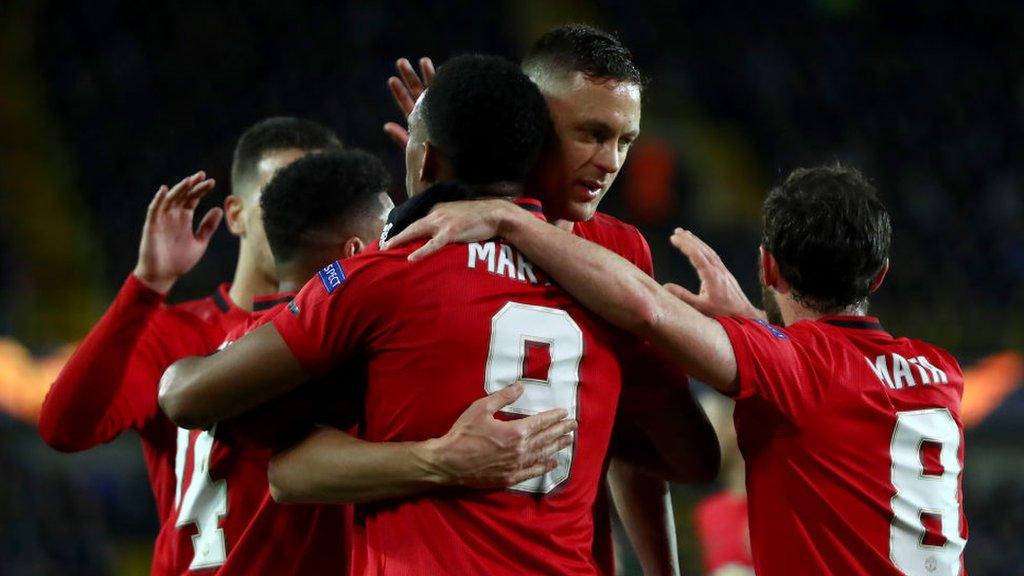 Manchester United players celebrate scoring against Club Bruges