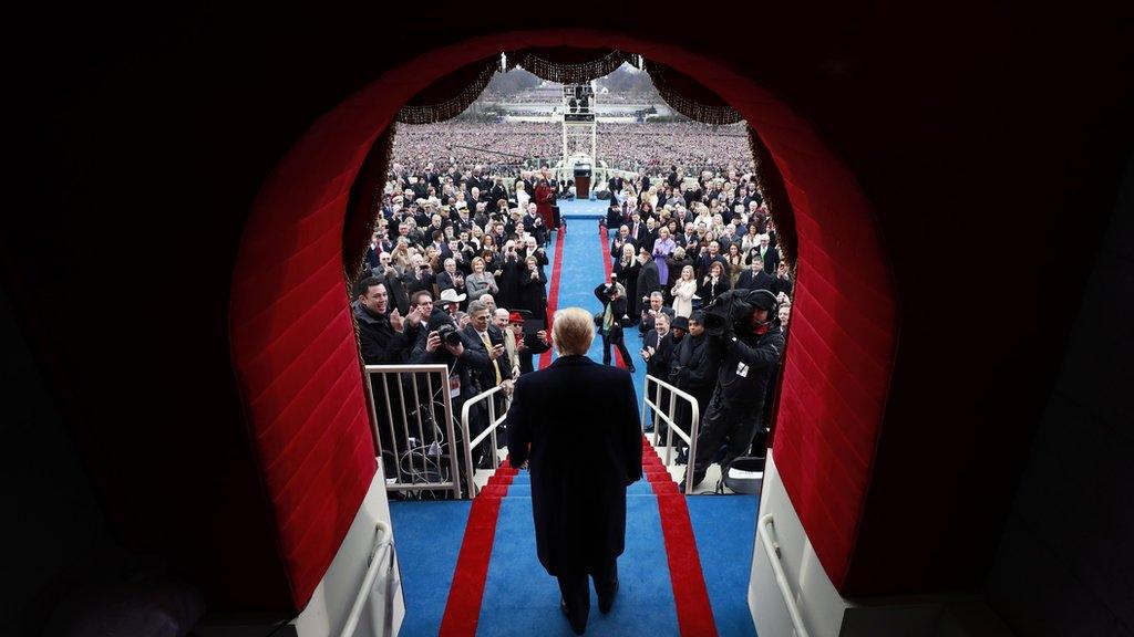 President-elect Donald Trump arrives to applause at the inauguration ceremony