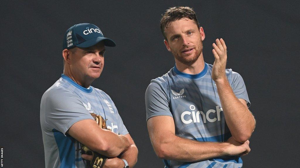 England coach Matthew Mott (left) chats to captain Jos Buttler (right)