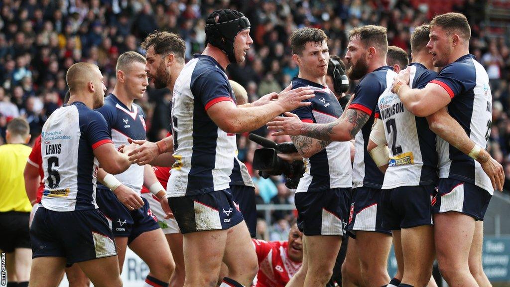 England celebrate a try against Tonga