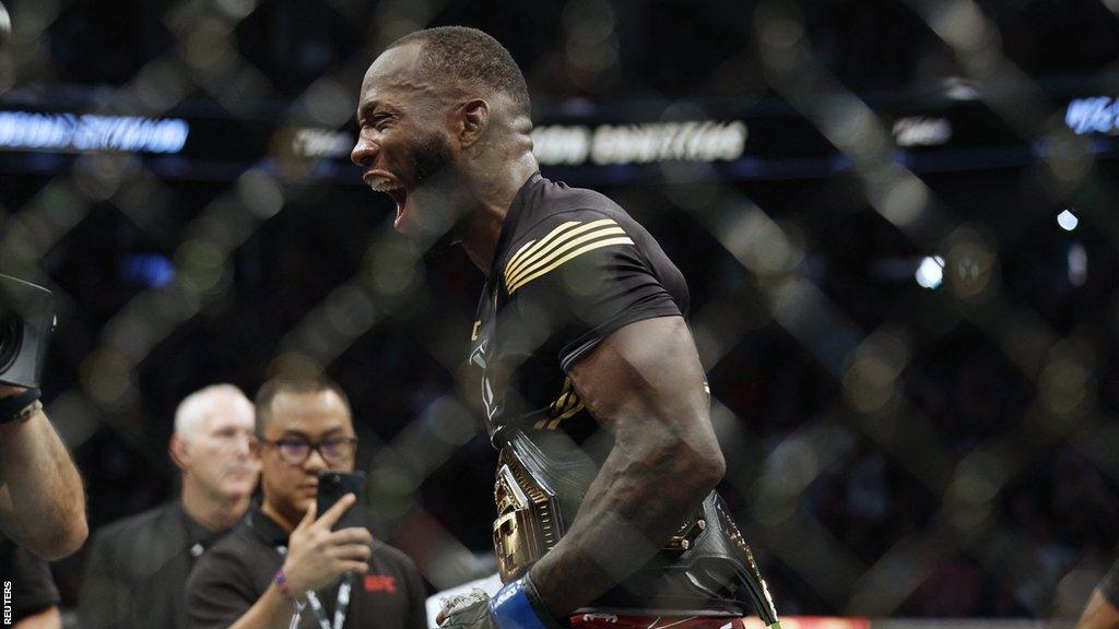 Leon Edwards celebrates in the cage